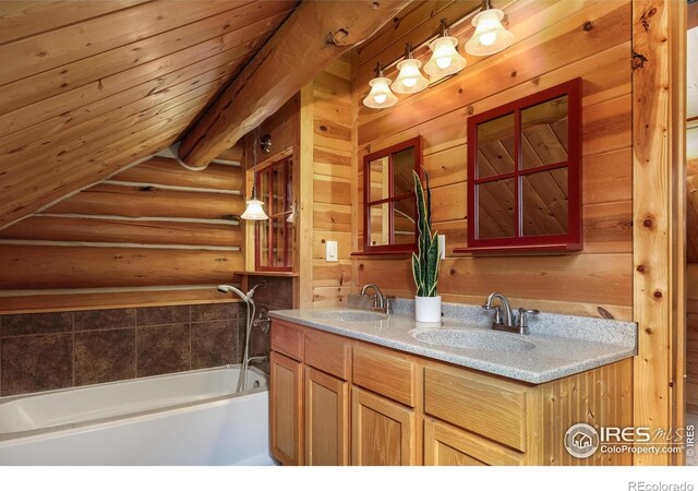 28 Ute Crossing Ct, Lyons, CO 80540 - full bathroom featuring log walls, double vanity, and a tub