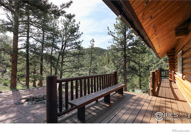 28 Ute Crossing Ct, Lyons, CO 80540 - wooden deck with a forest view