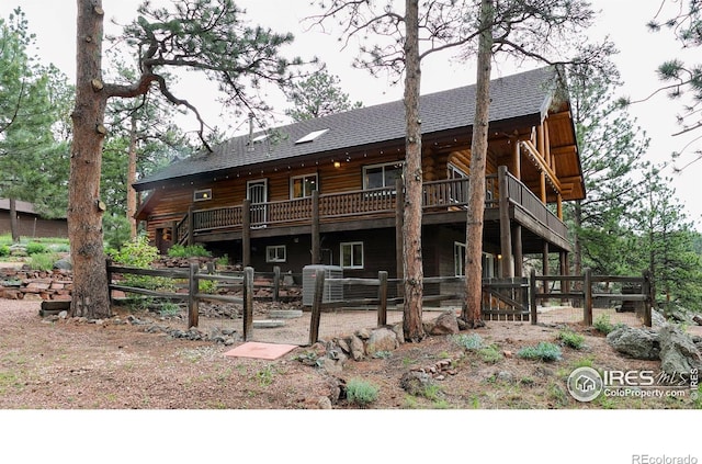 28 Ute Crossing Ct, Lyons, CO 80540 - back of property with roof with shingles, a deck, and log siding