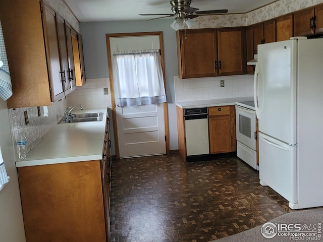 1918 Sumac Pl, Longmont, CO 80501 - kitchen featuring white appliances, a sink, a ceiling fan, light countertops, and tasteful backsplash