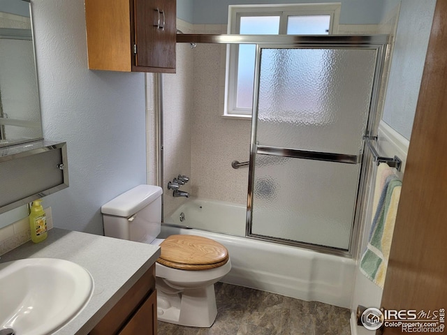 1918 Sumac Pl, Longmont, CO 80501 - bathroom with vanity, toilet, and bath / shower combo with glass door
