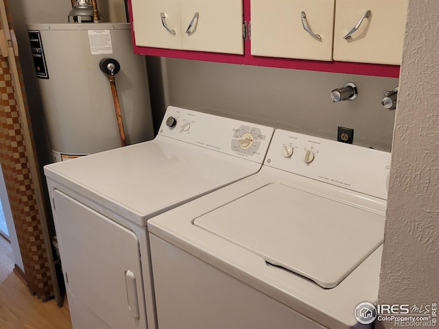 1918 Sumac Pl, Longmont, CO 80501 - laundry area with water heater, separate washer and dryer, and cabinet space