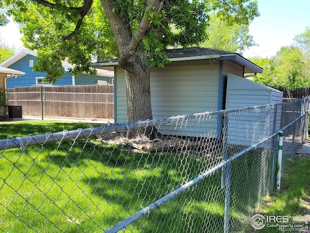 1918 Sumac Pl, Longmont, CO 80501 - view of home's exterior with a fenced backyard and central AC unit