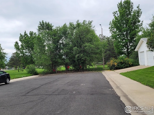 1918 Sumac Pl, Longmont, CO 80501 - view of asphalt street featuring sidewalks and curbs