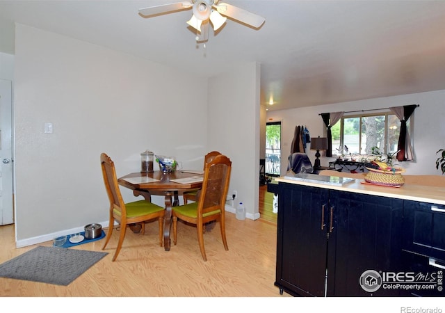 1405 Village Ln, Fort Collins, CO 80521 - dining room featuring ceiling fan, light wood-type flooring, and baseboards