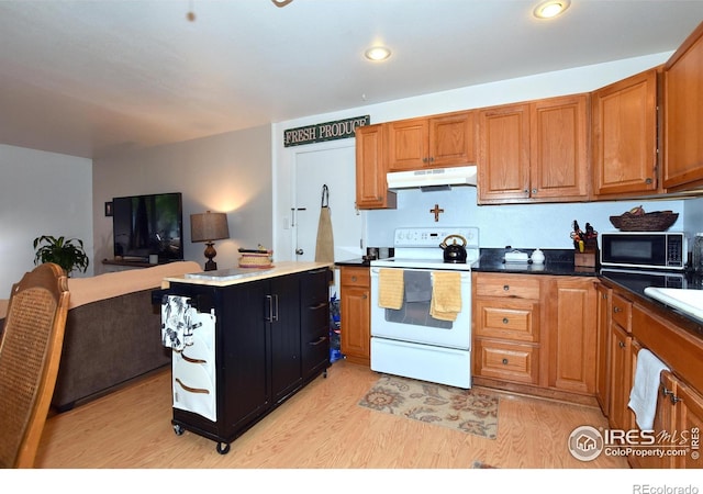 1405 Village Ln, Fort Collins, CO 80521 - kitchen with white range with electric cooktop, under cabinet range hood, black microwave, light wood-style floors, and recessed lighting