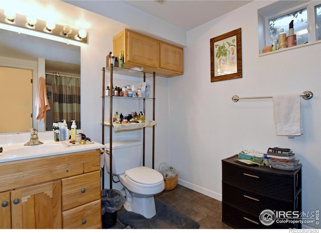 1405 Village Ln, Fort Collins, CO 80521 - bathroom with toilet, vanity, tile patterned flooring, baseboards, and curtained shower