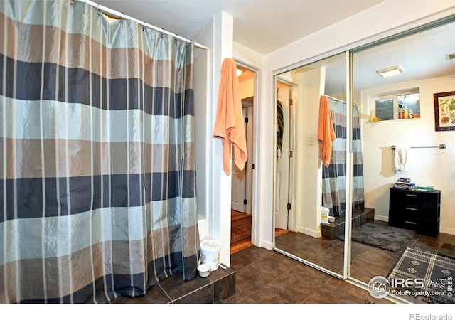1405 Village Ln, Fort Collins, CO 80521 - bathroom with tile patterned flooring, a shower with curtain, and baseboards