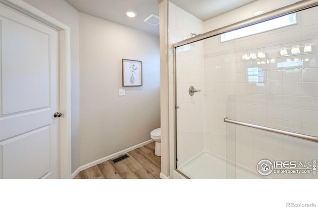 3356 Streamwood Dr, Johnstown, CO 80534 - full bath featuring a shower stall and wood finished floors