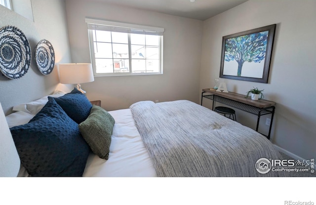3356 Streamwood Dr, Johnstown, CO 80534 - bedroom featuring baseboards