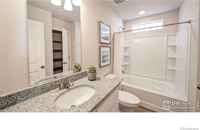 3356 Streamwood Dr, Johnstown, CO 80534 - full bath with vanity, shower / bathtub combination with curtain, and a textured wall