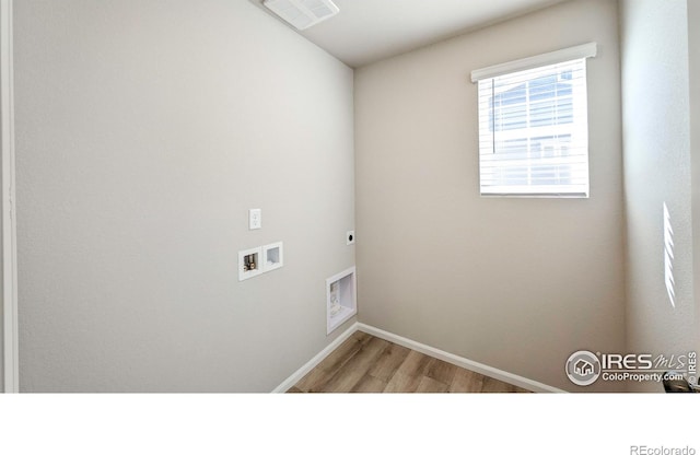 3356 Streamwood Dr, Johnstown, CO 80534 - laundry room featuring wood finished floors, hookup for an electric dryer, and hookup for a washing machine