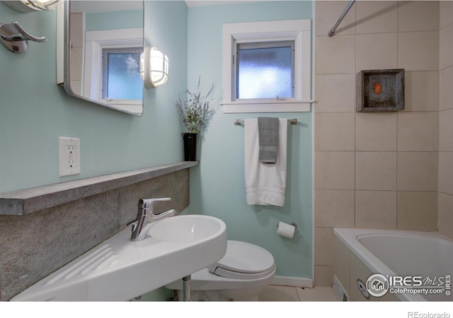 1110 Hartford Dr, Boulder, CO 80305 - full bathroom featuring a bathtub, toilet, a sink, baseboards, and tile patterned flooring