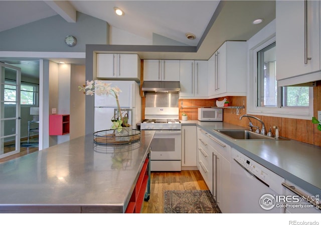 1110 Hartford Dr, Boulder, CO 80305 - kitchen featuring stainless steel counters, white appliances, under cabinet range hood, a sink, and white cabinets
