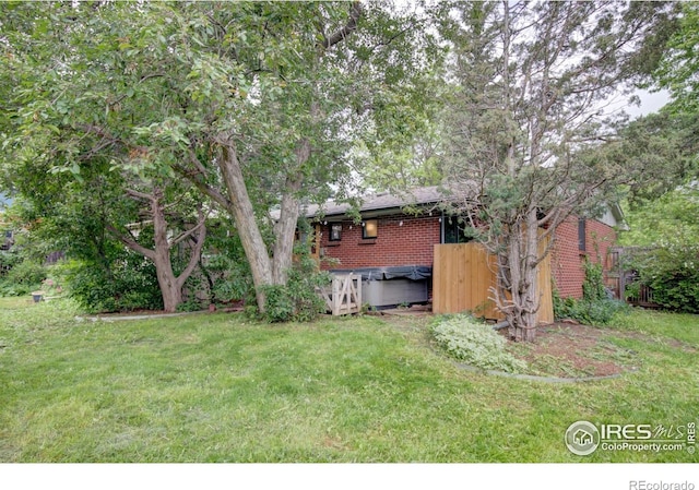 1110 Hartford Dr, Boulder, CO 80305 - view of green lawn featuring a hot tub
