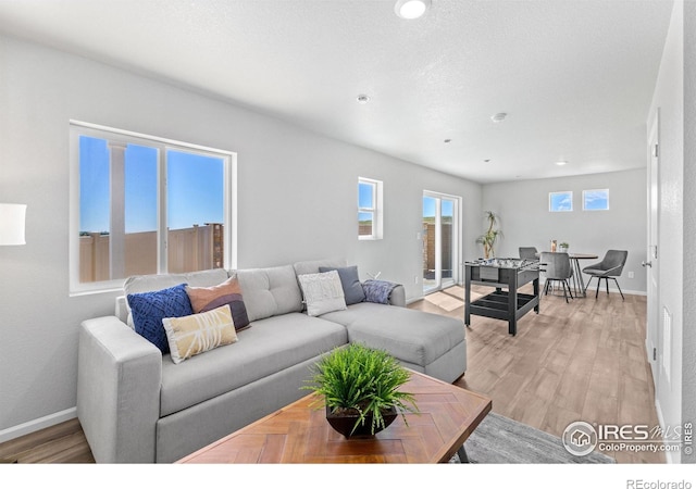 3364 Streamwood Dr, Johnstown, CO 80534 - living room featuring light wood-style floors and recessed lighting