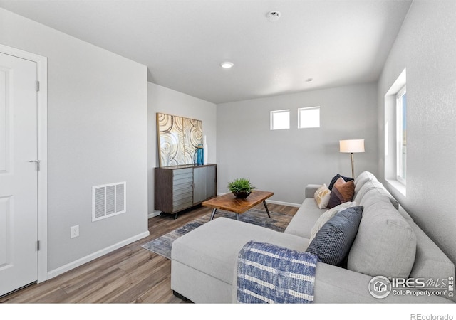 3364 Streamwood Dr, Johnstown, CO 80534 - living room featuring wood finished floors and recessed lighting