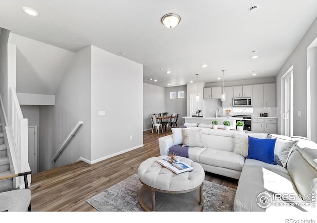 3364 Streamwood Dr, Johnstown, CO 80534 - living room with wood finished floors and recessed lighting