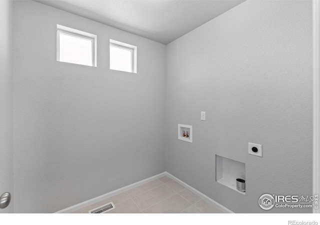 3364 Streamwood Dr, Johnstown, CO 80534 - laundry room with hookup for a washing machine, hookup for an electric dryer, and light tile patterned flooring