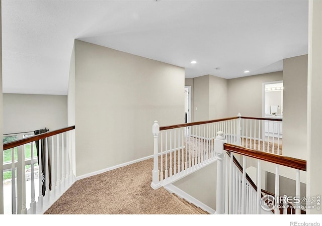 11740 Ivy St, Thornton, CO 80233 - hall with an upstairs landing, carpet floors, healthy amount of natural light, baseboards, and recessed lighting