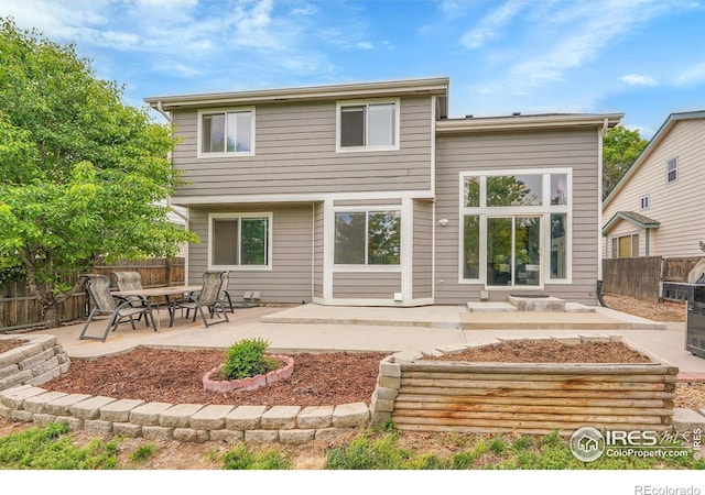 11740 Ivy St, Thornton, CO 80233 - back of house featuring a patio and a fenced backyard