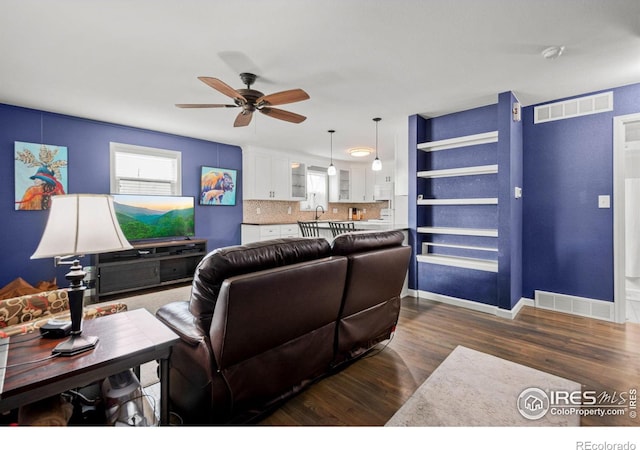 11385 Downing Dr, Northglenn, CO 80233 - living area with a ceiling fan, dark wood finished floors, and baseboards