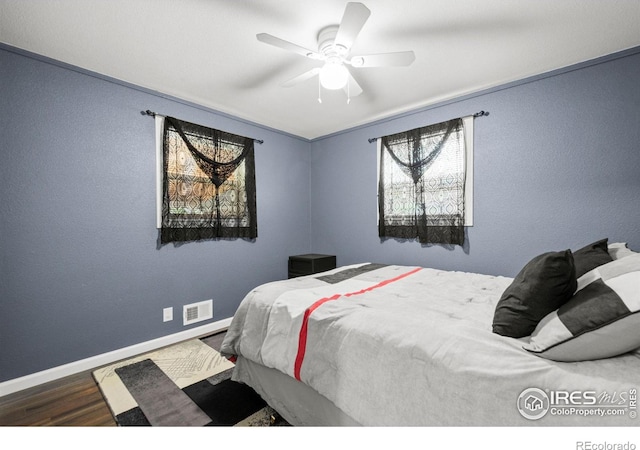 11385 Downing Dr, Northglenn, CO 80233 - bedroom featuring wood finished floors, baseboards, and ceiling fan