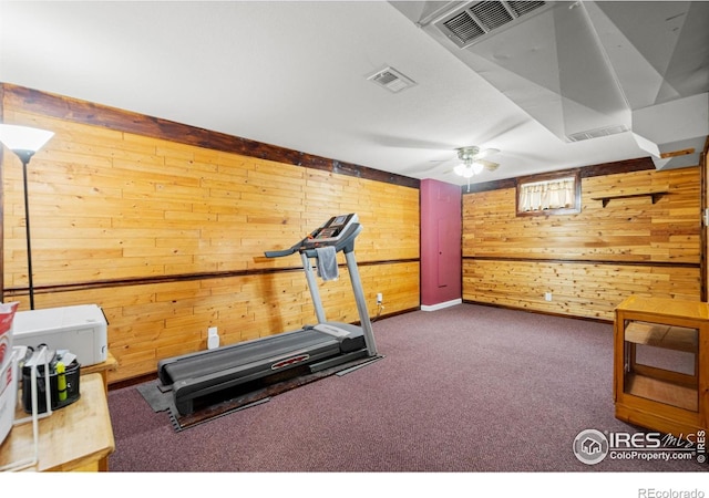 11385 Downing Dr, Northglenn, CO 80233 - exercise area featuring wood walls and carpet flooring