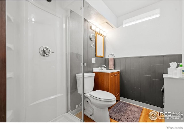 11385 Downing Dr, Northglenn, CO 80233 - bathroom featuring vanity, a stall shower, and toilet