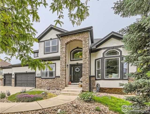 8839 Shetland Dr, Frederick, CO 80504 - traditional-style home with stucco siding, stone siding, driveway, and a garage