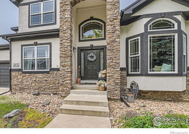 8839 Shetland Dr, Frederick, CO 80504 - doorway to property featuring stone siding and stucco siding