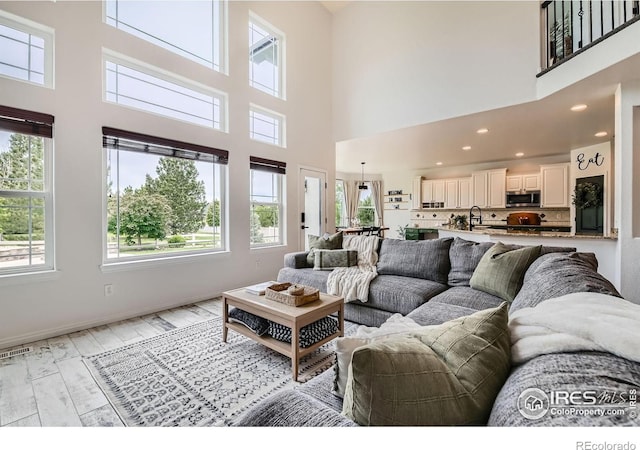 8839 Shetland Dr, Frederick, CO 80504 - living room featuring plenty of natural light and a high ceiling