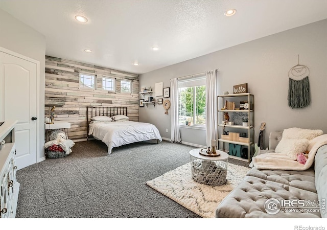 8839 Shetland Dr, Frederick, CO 80504 - carpeted bedroom with recessed lighting, wood walls, and baseboards