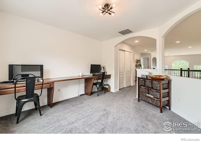 8839 Shetland Dr, Frederick, CO 80504 - carpeted home office featuring arched walkways, recessed lighting, and baseboards