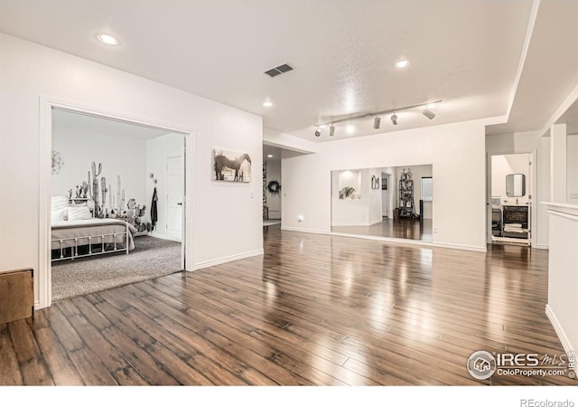 8839 Shetland Dr, Frederick, CO 80504 - living area featuring hardwood / wood-style floors, baseboards, recessed lighting, and rail lighting