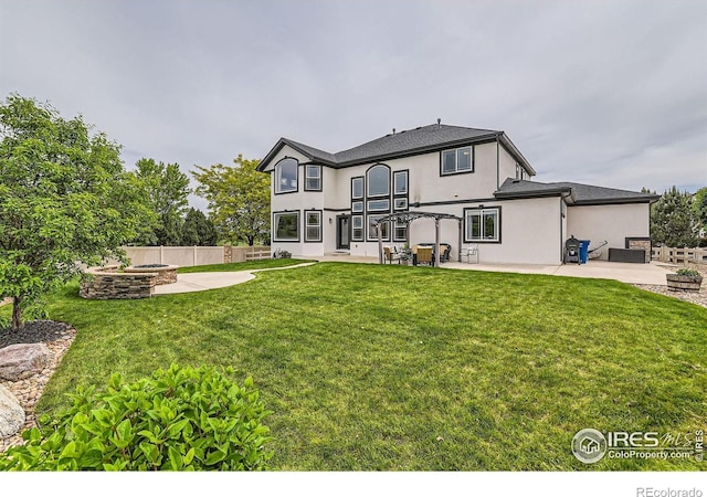 8839 Shetland Dr, Frederick, CO 80504 - rear view of property featuring a patio area, stucco siding, and a balcony