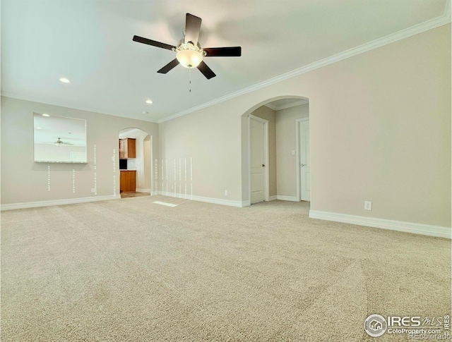 44502 County Road 68, Briggsdale, CO 80611 - unfurnished living room with arched walkways, crown molding, light colored carpet, ceiling fan, and recessed lighting