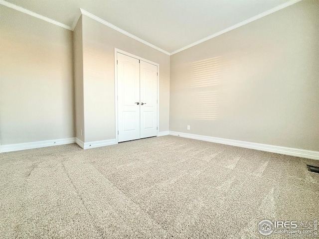 44502 County Road 68, Briggsdale, CO 80611 - unfurnished bedroom featuring ornamental molding, baseboards, a closet, vaulted ceiling, and carpet