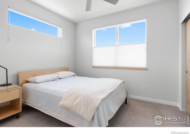 876 Cimarron Dr Unit B, Lafayette, CO 80026 - bedroom featuring baseboards, ceiling fan, and carpet floors