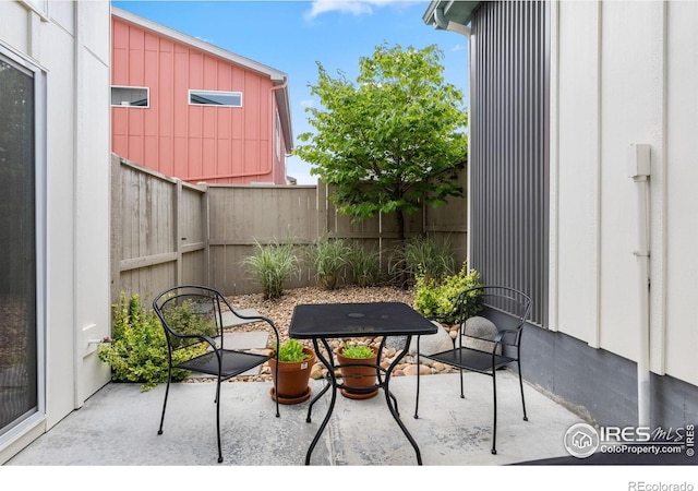 876 Cimarron Dr Unit B, Lafayette, CO 80026 - fenced backyard featuring a patio and outdoor dining space