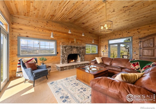 2507 Spencer Mountain Rd, Bellvue, CO 80512 - living room with wooden walls, vaulted ceiling, carpet, a fireplace, and wooden ceiling