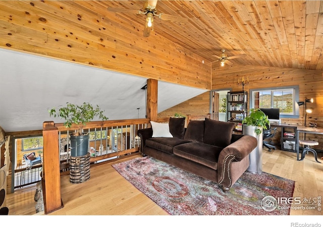 2507 Spencer Mountain Rd, Bellvue, CO 80512 - living area featuring a ceiling fan, wood walls, vaulted ceiling, hardwood / wood-style floors, and an office area