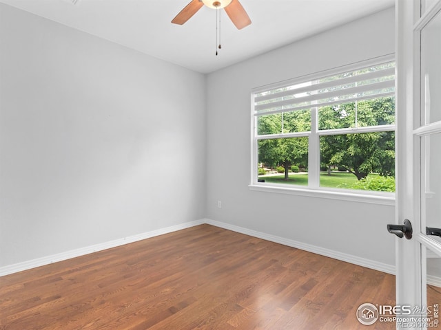 603 Summer Hawk Dr, Longmont, CO 80504 - unfurnished room with baseboards, dark wood-style flooring, and ceiling fan