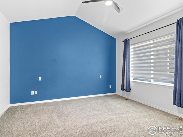 603 Summer Hawk Dr, Longmont, CO 80504 - spare room with vaulted ceiling, a ceiling fan, carpet floors, and baseboards