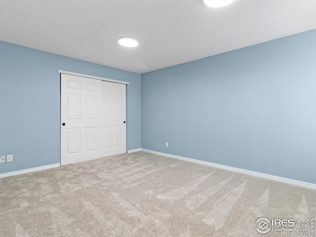 603 Summer Hawk Dr, Longmont, CO 80504 - unfurnished bedroom with carpet floors, baseboards, and a closet