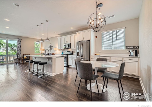 4343 E 96th Way, Thornton, CO 80229 - dining space with dark wood-style floors and recessed lighting