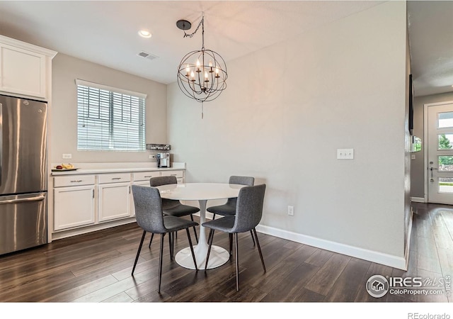 4343 E 96th Way, Thornton, CO 80229 - dining space featuring dark wood finished floors, a chandelier, baseboards, and recessed lighting