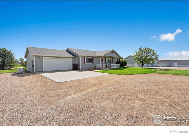 32924 County Road 29, Greeley, CO 80631 - ranch-style home featuring driveway, a garage, a porch, a front lawn, and cooling unit