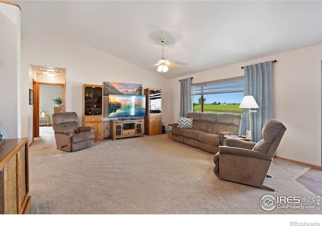 32924 County Road 29, Greeley, CO 80631 - carpeted living area featuring vaulted ceiling and a ceiling fan