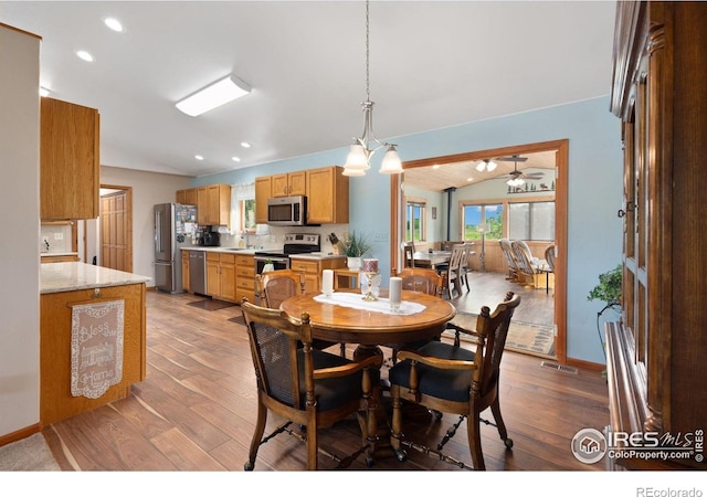 32924 County Road 29, Greeley, CO 80631 - dining space featuring lofted ceiling, light wood-type flooring, a ceiling fan, recessed lighting, and baseboards